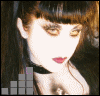 A woman with dark hair and bangs, wearing a black top, appears in with changing pink bar graphs below her face