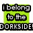 Green square background with black text reading "i belong to the DORKSIDE" on top left, "with my LEADER" on top right, and "CARLOS!!!" on bottom left.