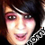 Pixelated close-up of a person's face with dark hair, pink eyeshadow, and visible mouth in a static 50x50 icon format.