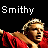 Pixelated image of a person in red clothing with text "Smithy" and "#17" on black background, showing partial cropping.