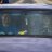Static pixelated image with horizontal bands of muted colors including blue, gray, and yellow, showing no distinct subjects or text.