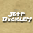 Pixelated grayscale portrait of a person with tousled hair against a beige background, with white text reading "JEFF BUCKLEY" on the left.