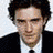 A contact sheet of three 48x48 pixel frames showing a man in formal attire with subtle facial expression changes across the animation sequence.