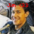 Pixelated image of a person with light skin and short dark hair, wearing a dark jacket over a white shirt, with red text reading 'Jim (33)' above the head.