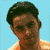 Pixelated static image of a person's head and shoulders against light blue background, wearing orange sleeveless top with white trim.