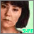 A pixelated image of a person with short dark hair against a light green background, with the text 'SHAN' in the bottom right corner.