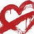 Red heart-shaped icon with smooth curved lines forming a continuous loop on white background.