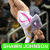 Pixelated image of a person in white clothing with pink accents holding an object, set against dark background with green text bar at bottom.