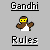 Pixel art icon with "Gandhi" and "Rules" text above and below a stylized figure wearing yellow goggles, brown arms, white torso, and black outline on gray background.