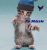 A dancing cat wearing a blue hat with a dark brim, standing on hind legs against a light teal background.