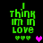 Green pixelated text reads "I think I'm in love" with three green hearts below, and a single heart changes color from pink to purple across frames.