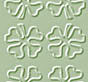 A static grid of four identical white clover-like symbols on a light green background, each with rounded petals and subtle shading.