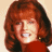 A 48x48 pixel buddy icon split into two sections: a left-side portrait of a person with red hair and right-side green text on dark background.