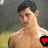 A shirtless person with dark hair stands in a grassy outdoor setting with a blurred background, featuring a red heart symbol on the chest in one view.