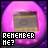 Pixelated image with pink and purple gradient background, central rectangular object with brown and gray tones, and white text reading "REMEMBER ME?" in black block letters.