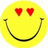 Yellow circular smiley face with red heart-shaped eyes and black curved mouth, surrounded by pixelated text reading "How did smiley And I find love... didn't?" on white background.