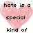 Pixelated pink hearts with black text arranged in a , displaying phrases about hate and love, with a gray rectangle in the bottom-right corner