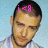 A pixelated image of a person with short dark hair wearing a striped shirt, featuring pink text above the head that changes from 'i < 8' to 'justin'.