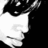 Black-and-white pixelated image of a person's face in profile with text elements 'OnLy', 'ONE', and 'TRiNa' on black background.