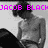Pixelated grayscale image of a shirtless person with dark hair, overlaid by bright pink text reading "JACOB BLACK" at the top.