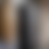 A pixelated grayscale gradient image with vertical bands of varying lightness from dark gray to white.
