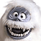Pixelated close-up of a cartoonish face with wide eyes, sharp teeth, and light-colored fur-like texture against white background.