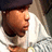 A person wearing a dark cap and white shirt with striped sleeves appears in four showing slight head position changes