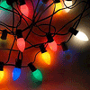 Four display a string of multicolored Christmas lights with visible color changes