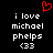 Red pixelated heart symbol above white text reading 'i love michael phelps <33' on black background.