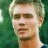 Pixelated image of a person with light hair against green background, next to bright green text reading 'Original Icons .com' on dark green backdrop.