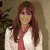 Four pixelated images of a woman with long red hair in different poses and backgrounds, one displaying text.