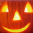 Pixelated orange pumpkin face with glowing eyes and mouth on black background, accompanied by red pixel text reading 'im done... HAPPY HOLLOWEEH' and 'mmwww hahahaha...'