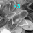 Pixelated grayscale image with cyan '43' text overlay on a blurred background of indistinct shapes.