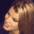 Pixelated static image of a person's face with closed eyes and brown hair against dark background, rendered in low-resolution 256x256 pixels.