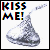Two side-by-side pixelated show a Hershey's Kiss candy with 'KISS ME!' text; left has colorful glitched text, right shows faded gray text