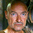 A 48x48 pixel buddy icon featuring a split composition with a person's face on the left and bold text on the right, displayed as part of an animated contact sheet.