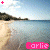 Animated beach scene with pink text 'Carlie' changing across frames, featuring a shoreline and sky background.