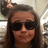 A pixelated image shows a person with long brown hair and dark sunglasses on the left, next to red text reading 'good times at TARGET!!!!!!' on a dark blue background.