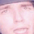 A pixelated close-up of a person's face with closed eyes, rendered in soft pink and white tones against a muted purple background.