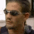 repeated images showing a person with dark hair tied back, wearing sunglasses and a dark shirt, with 'LELAND' text overlaid