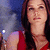 A woman with long brown hair in a red sleeveless top appears across three , the rightmost showing her face slightly shifted left