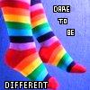 Rainbow-striped leggings on a blue background with pixelated text reading DARE TO BE DIFFERENT.