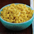 A four- with a bowl of macaroni in the top-left, orange background text reading 'you are the cheese' in the top-right, and partial yellow background text reading 'to my macaroni' in the bottom-left