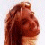 A person with long brown hair appears in three distinct poses: profile view, front-facing smiling, and slightly angled smile.
