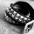 Black and white pixelated image of a shoe with visible laces on a light gray background.