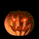 Two circular pumpkin faces with carved expressions; left face has closed eyes and orange glow, right face has black eye sockets with one blue dot.