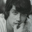Pixelated grayscale image of a person with dark hair resting their head on hands, next to blue with white pixel text reading 'your voice could break' and 'the loudest silence'
