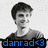 A pixelated grayscale portrait of a smiling person with short dark hair wearing a crew-neck shirt, overlaid with colored text reading "danrad<3" in blue, pink, and green.
