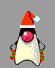 A pixelated character with a red Santa hat, pink face, and white body wears green-and-red striped mittens while holding small wrapped gifts.
