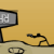 Pixelated icon shows a gray monitor with white 'A' and 'M' symbols on screen, black cables extending from its base, and a beige keyboard below on a yellow background.